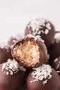 Coconut-Balls-close-up-with-bite.webp